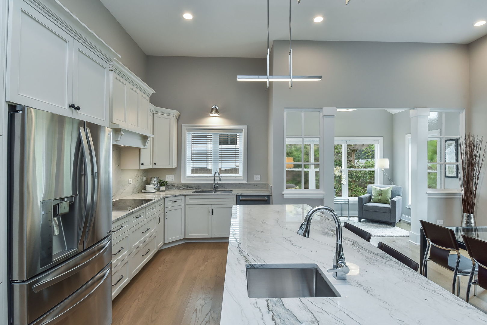 436 East Hillside Road Naperville, IL 60540 - Photo 15 of 59 a large kitchen with kitchen island a large center island a sink stainless steel appliances and cabinets
