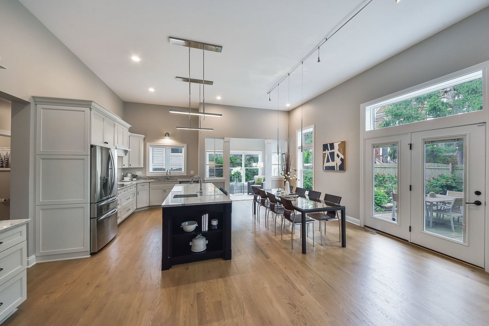 436 East Hillside Road Naperville, IL 60540 - Photo 17 of 59 a living room with furniture dining table and a large window