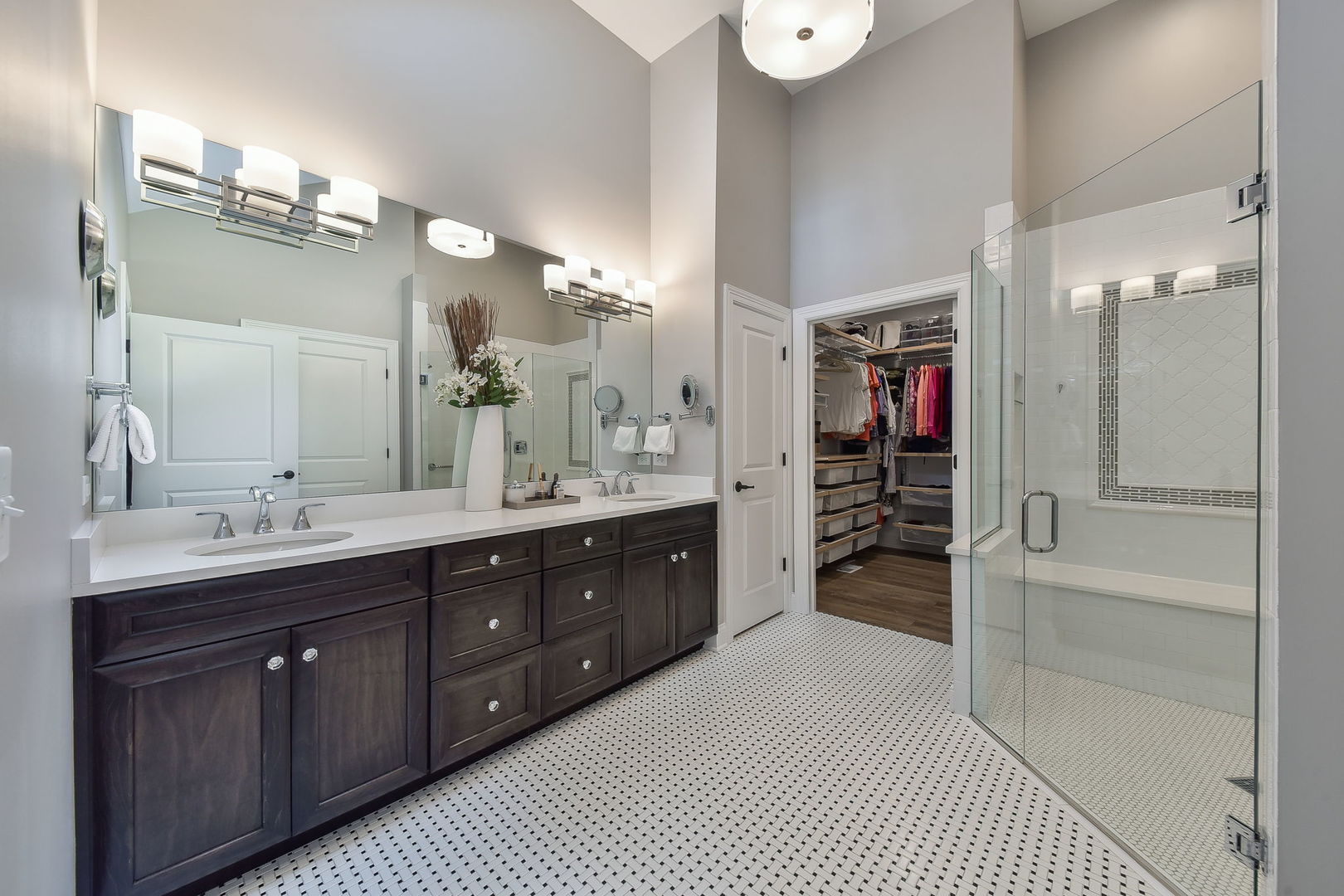 436 East Hillside Road Naperville, IL 60540 - Photo 24 of 59 a spacious bathroom with a double vanity sink a mirror and a shower