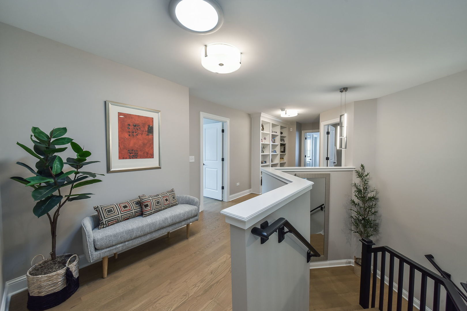 436 East Hillside Road Naperville, IL 60540 - Photo 29 of 59 a view of a livingroom with furniture and a potted plant