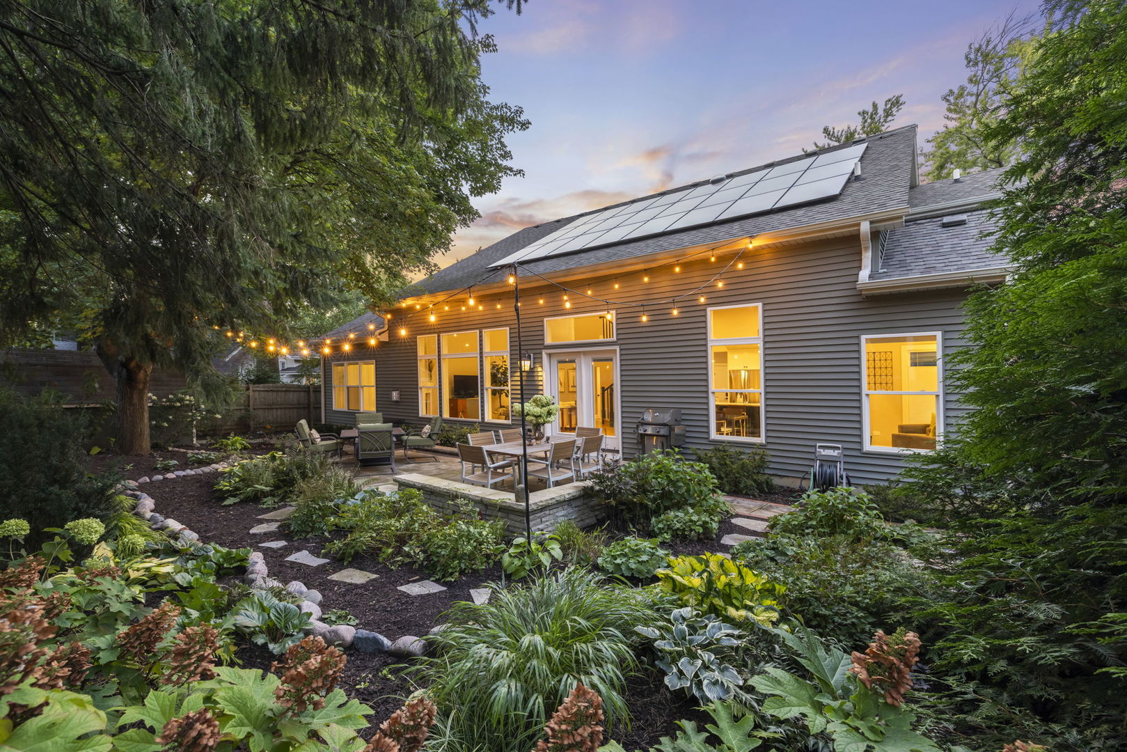 436 East Hillside Road Naperville, IL 60540 - Photo 49 of 59 a view of a house with sitting area and garden