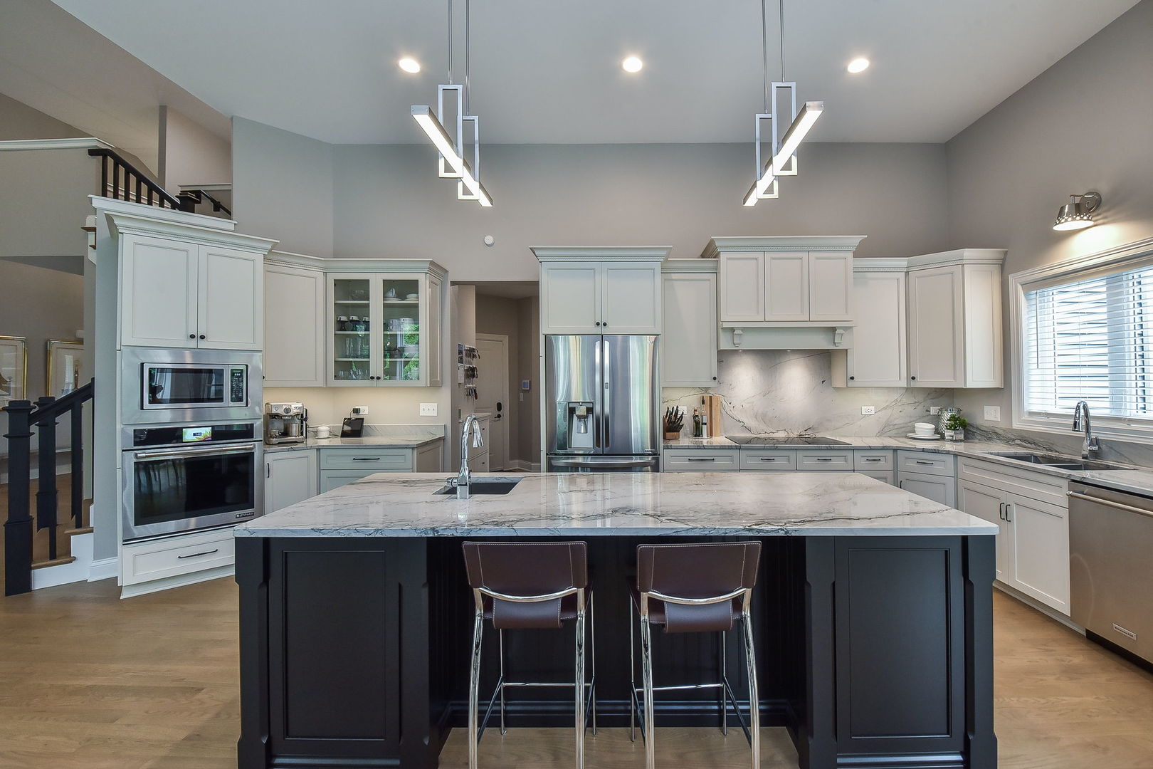 436 East Hillside Road Naperville, IL 60540 - Photo 5 of 59 a large kitchen with stainless steel appliances lots of counter space and breakfast area