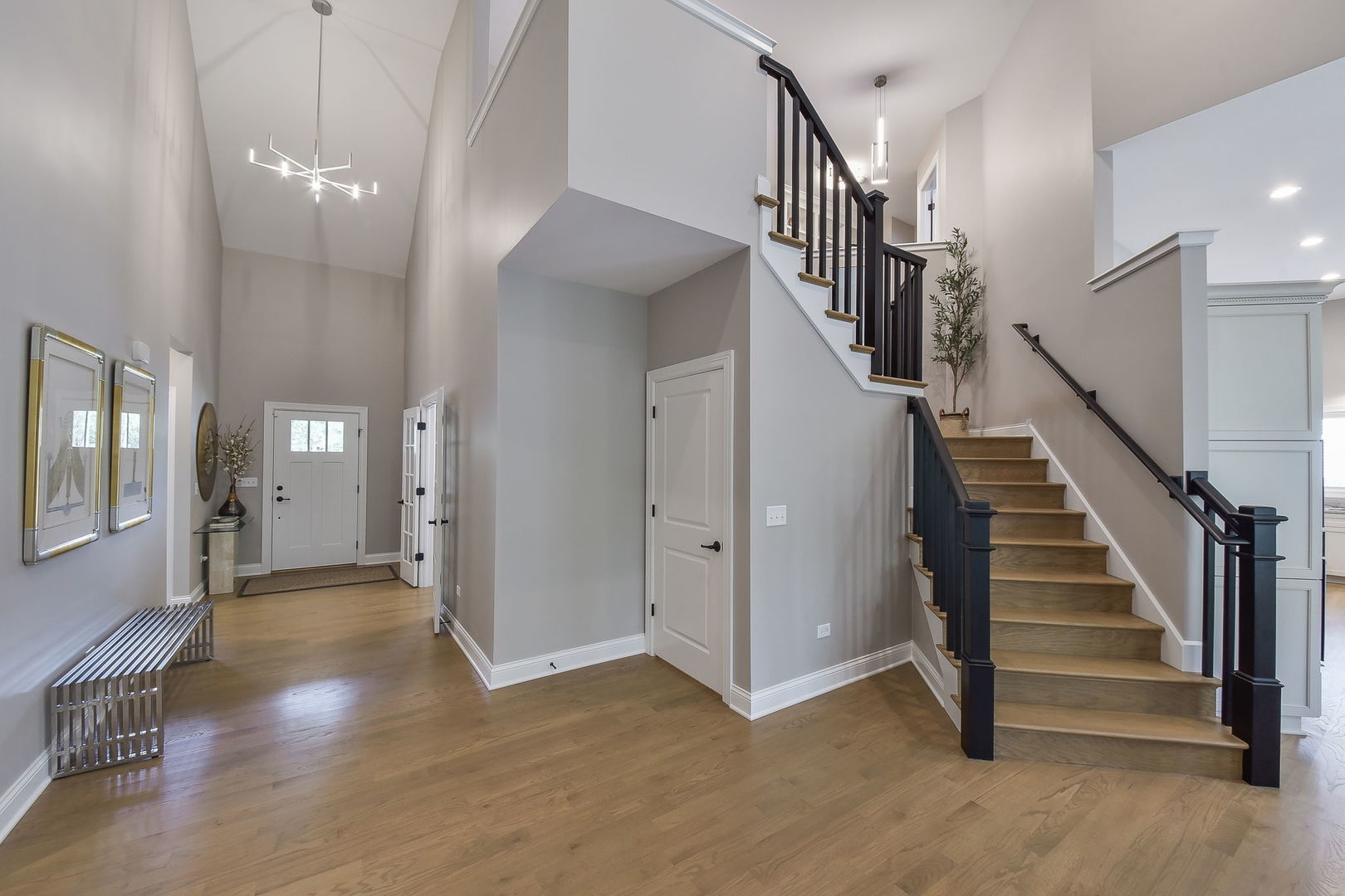 436 East Hillside Road Naperville, IL 60540 - Photo 6 of 59 a view of a hallway with entryway and stairs