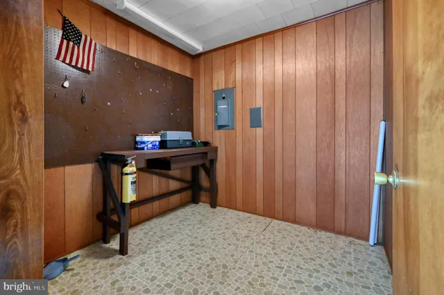 a room that has a bed and a table in it