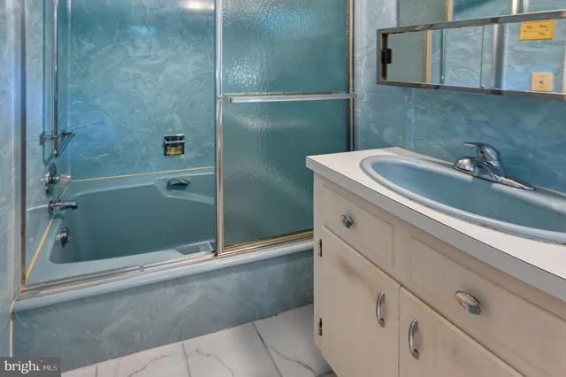 a bathroom with a sink and a shower
