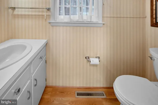 a bathroom with a sink and toilet