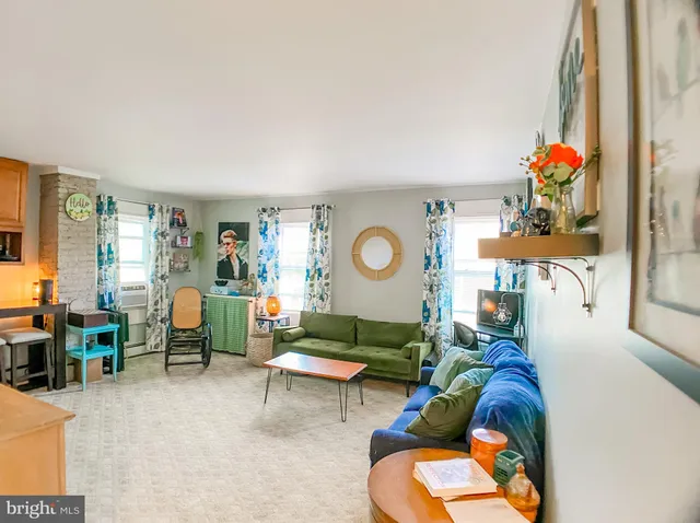 a living room with furniture and a table