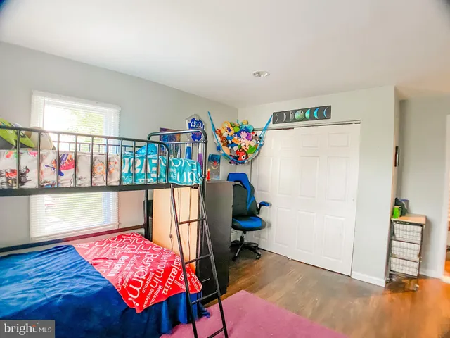 a room with furniture and a wooden floor