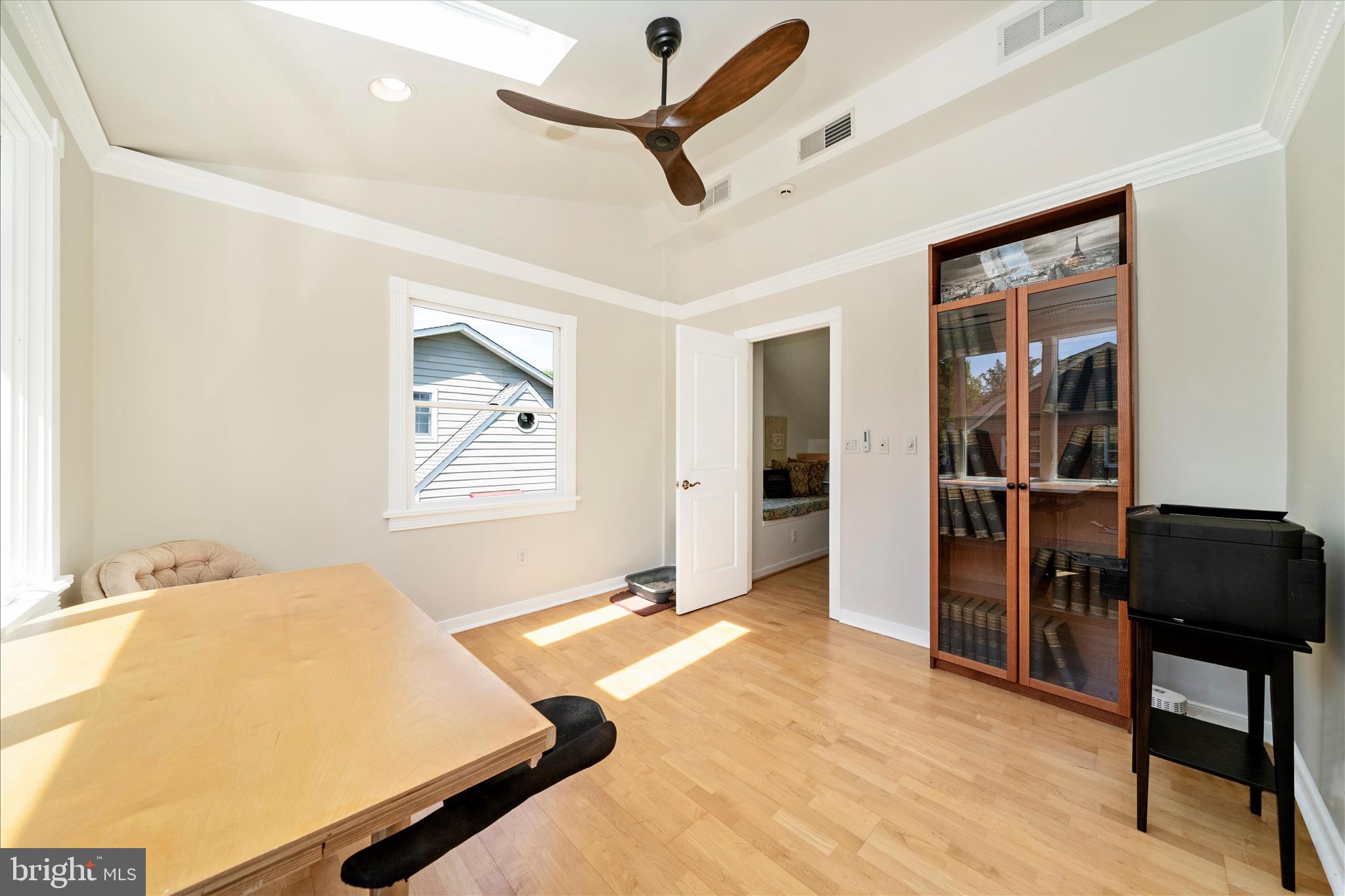 9300 Mintwood Street Silver Spring, MD 20901 - Photo 38 of 115 a bedroom with a bed and a desk