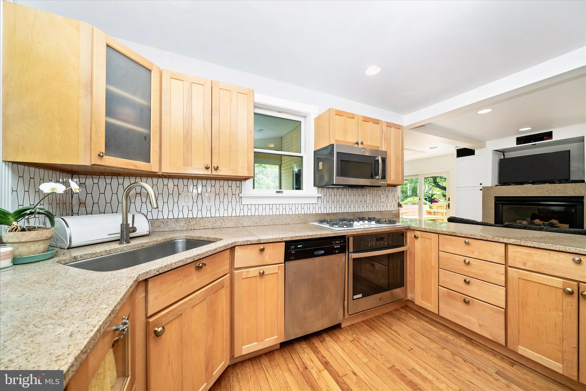 9300 Mintwood Street Silver Spring, MD 20901 - Photo 71 of 115 a kitchen with stainless steel appliances granite countertop a sink stove and microwave