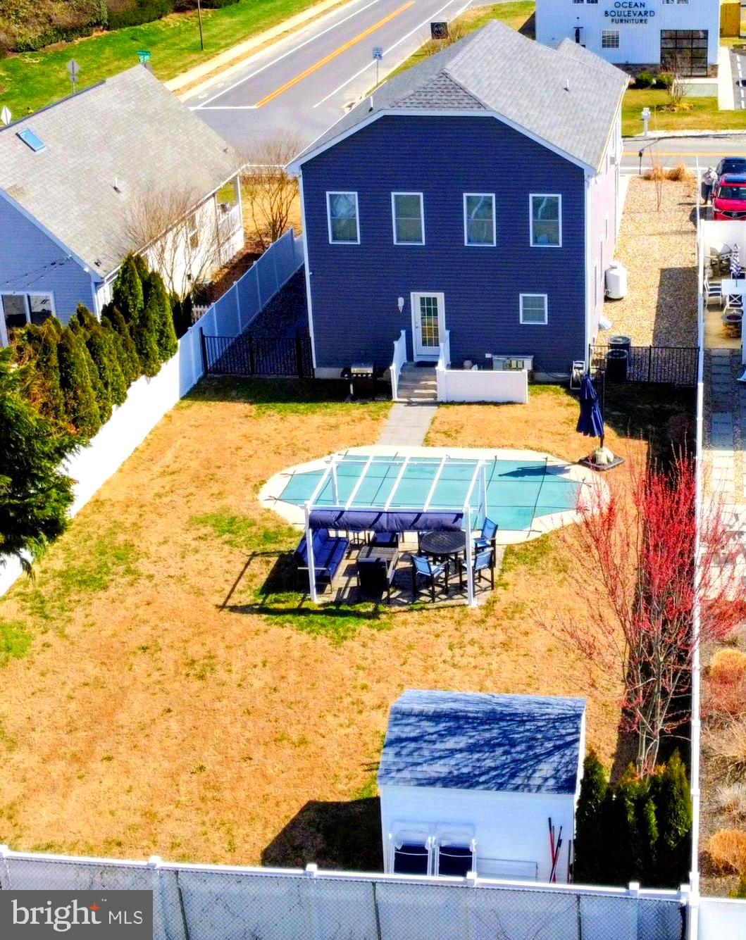 19798 Hebron Road Rehoboth Beach, DE 19971 - Photo 3 of 11 a view of a building with swimming pool