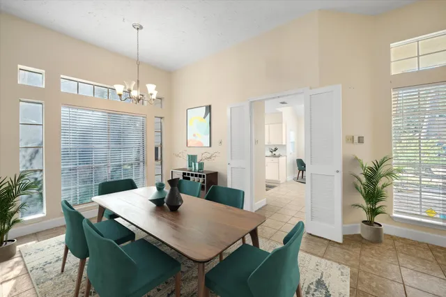 a view of a dining room with furniture and window