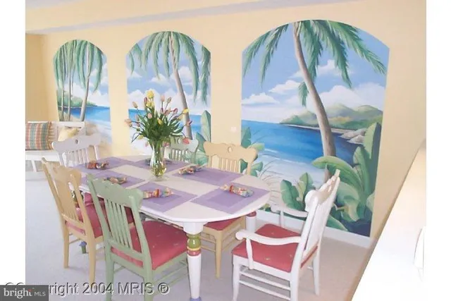 a view of a dining table and chairs in the patio