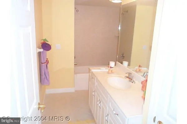 a view of a bedroom with bed and dresser