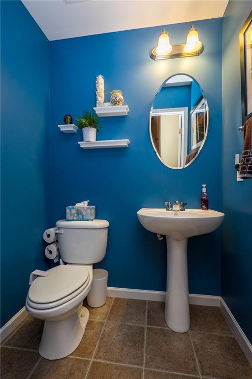 305 Broadstone Drive Mars, PA 16046 - Photo 14 of 25 This lovely powder room with pedestal sink is located just off the kitchen and living room.