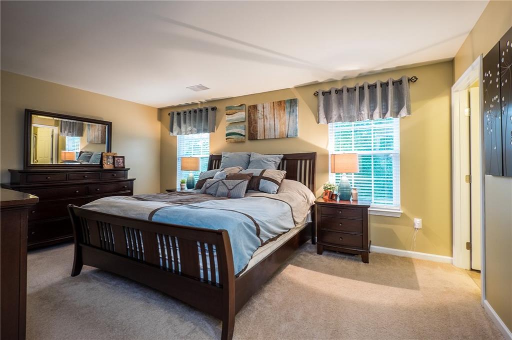 305 Broadstone Drive Mars, PA 16046 - Photo 15 of 25 The large master bedroom is flanked with 2 windows that overlook the private backyard.