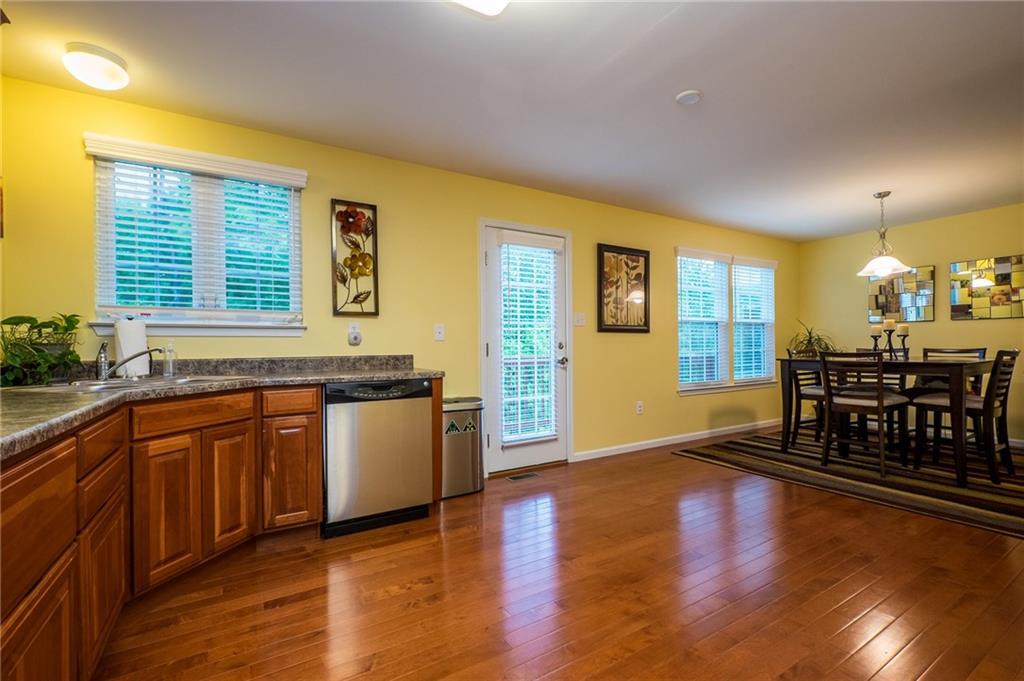 305 Broadstone Drive Mars, PA 16046 - Photo 5 of 25 Glistening hardwood floors span the huge kitchen with room for a large dining table.