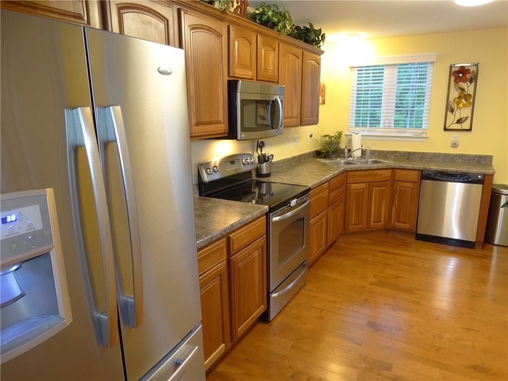 305 Broadstone Drive Mars, PA 16046 - Photo 7 of 25 Wonderful stainless steel appliances with cherry cabinets, shine next to the true hardwood floors