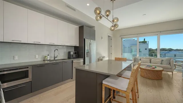 a very nice looking kitchen with a large window