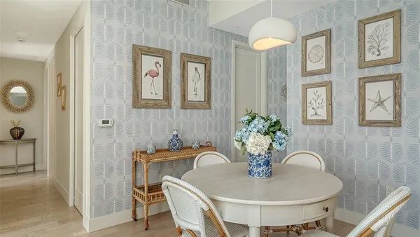 a dining room with furniture and window