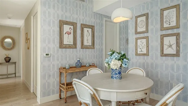 a dining room with furniture and window