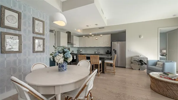 a view of a dining room with furniture and chandelier