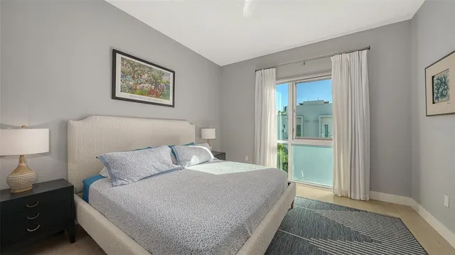 a bedroom with a bed and a lamp