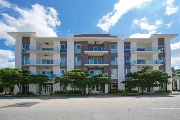 a front view of building with yard