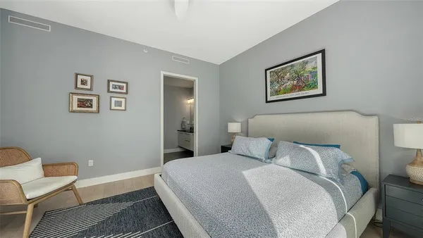 a bedroom with a bed and a couch