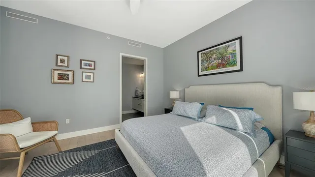 a bedroom with a bed and a couch