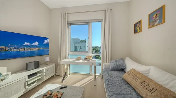 a reading room with furniture and a window