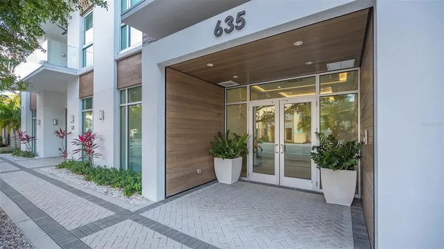 a view of a porch with potted plants