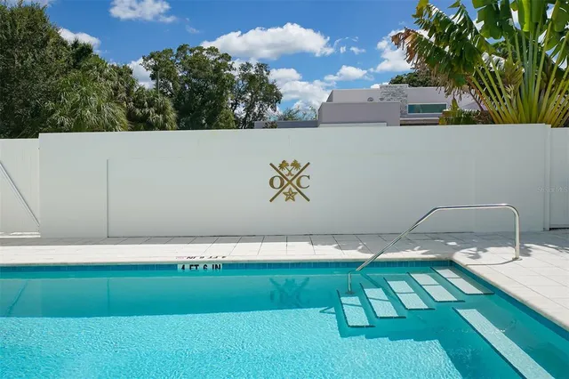 a view of a patio with a table and chairs
