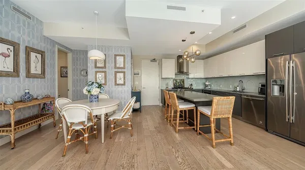 a view of a dining room with furniture and wooden floor
