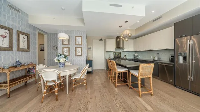 a view of a dining room with furniture and wooden floor