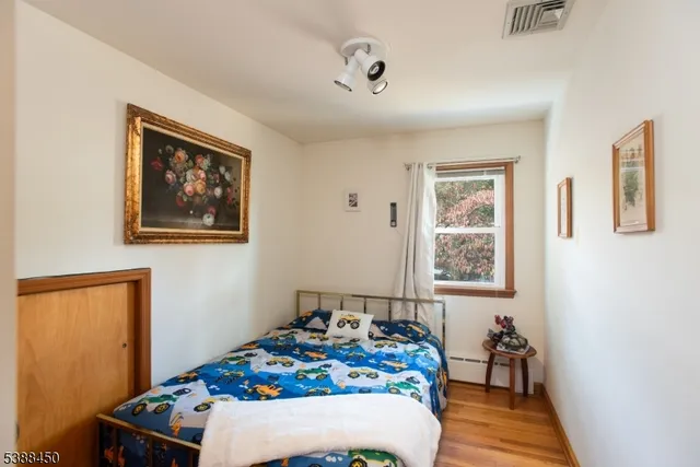 a bedroom with furniture and a window