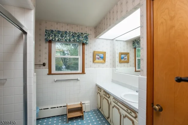 a bathroom with a tub and a window