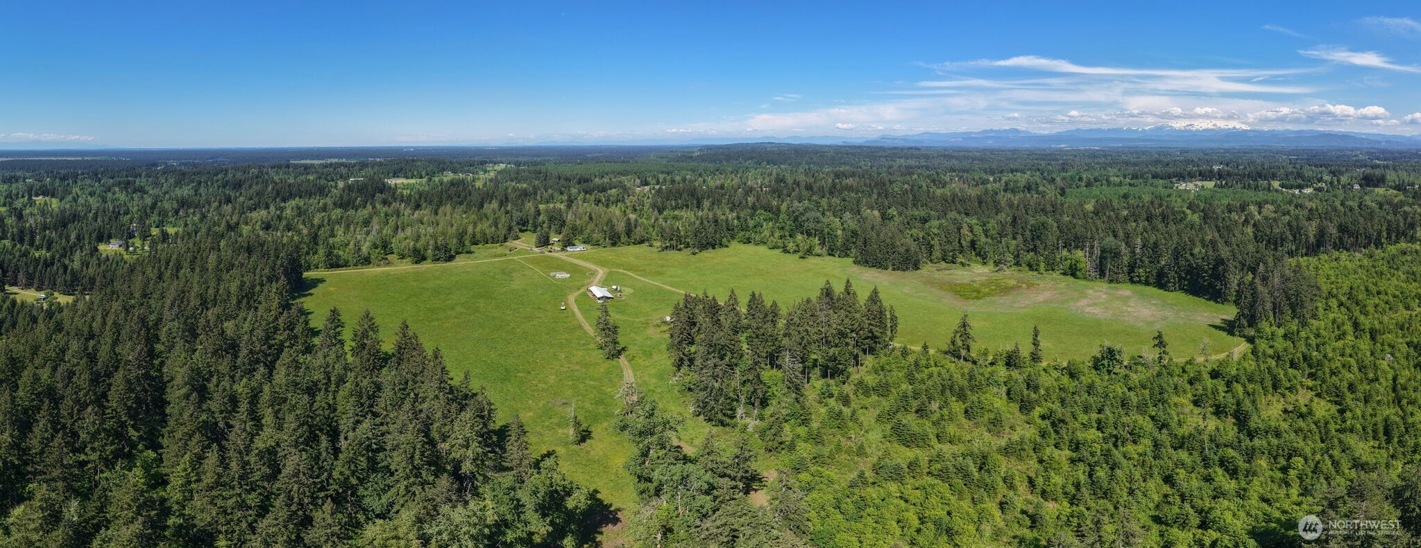 1716 304th Street East Roy, WA 98580 - Photo 3 of 21 a view of a green field with lots of green space
