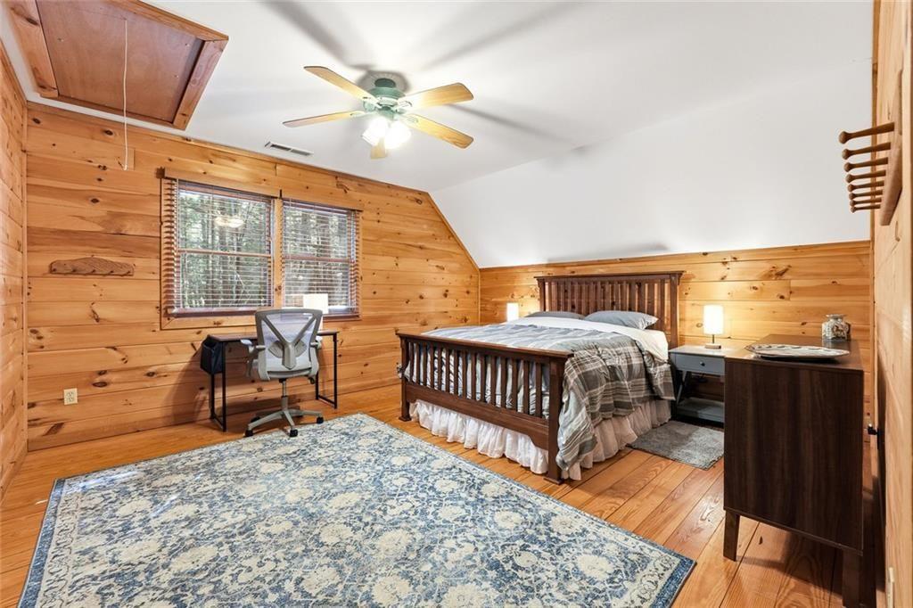 834 Indian Cave Road Ellijay, GA 30536 - Photo 20 of 44 a bedroom with furniture and a window