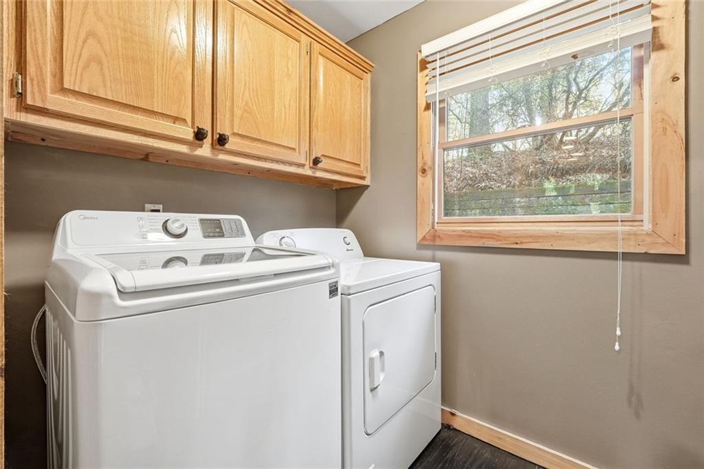 834 Indian Cave Road Ellijay, GA 30536 - Photo 22 of 44 a utility room with dryer and washer