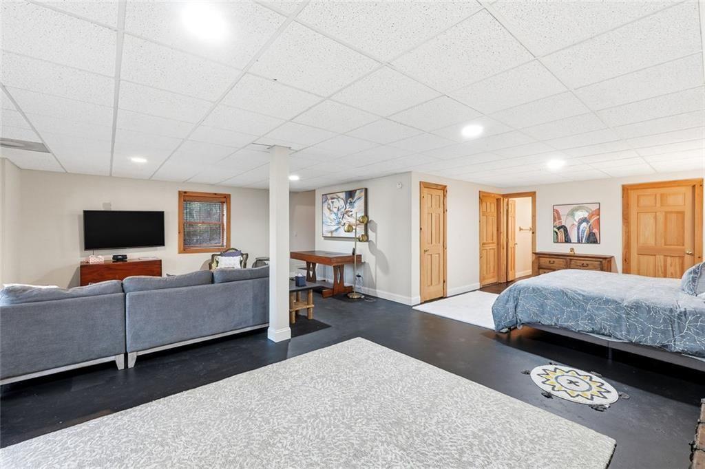 834 Indian Cave Road Ellijay, GA 30536 - Photo 24 of 44 a living room with furniture and a flat screen tv