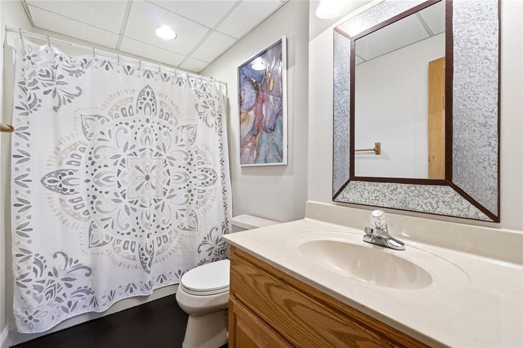 834 Indian Cave Road Ellijay, GA 30536 - Photo 27 of 44 a bathroom with a sink toilet and shower