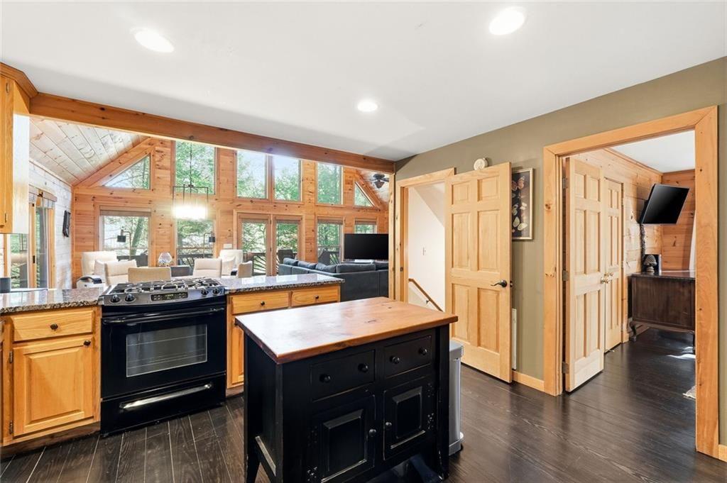 834 Indian Cave Road Ellijay, GA 30536 - Photo 3 of 44 a large kitchen with a large window and stainless steel appliances
