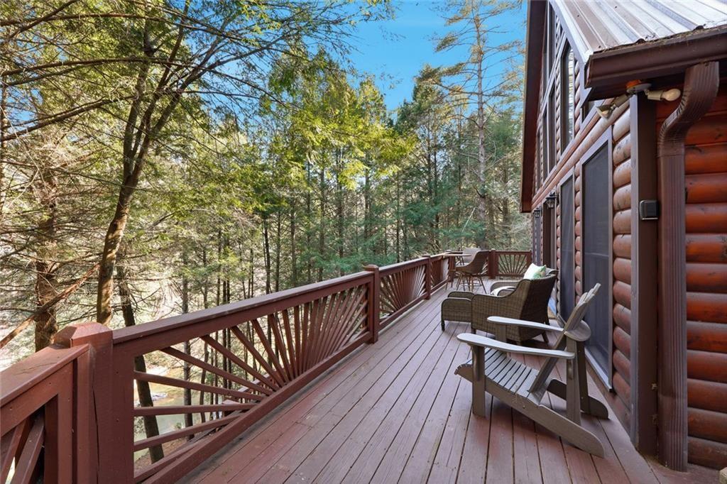 834 Indian Cave Road Ellijay, GA 30536 - Photo 31 of 44 a view of balcony with wooden floor and seating space