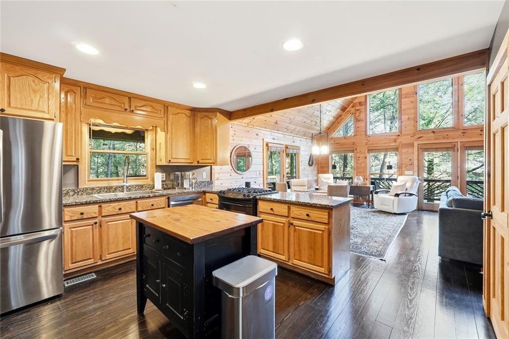 834 Indian Cave Road Ellijay, GA 30536 - Photo 4 of 44 a kitchen with granite countertop lots of counter top space and stainless steel appliances