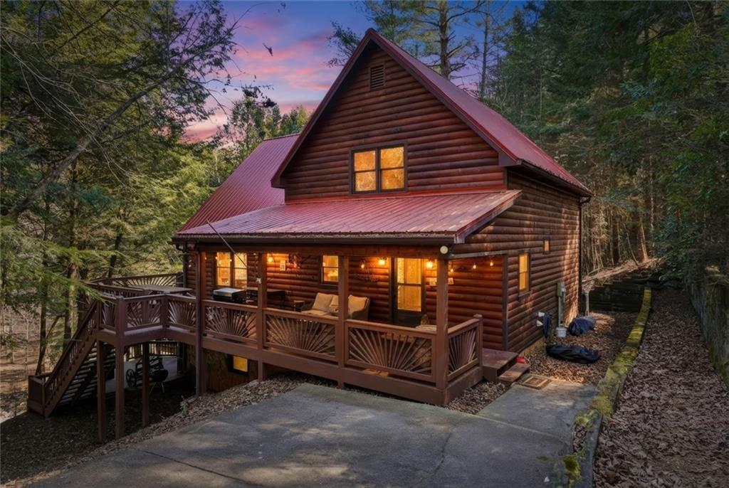 834 Indian Cave Road Ellijay, GA 30536 - Photo 44 of 44 a view of a wooden chairs and table in the backyard