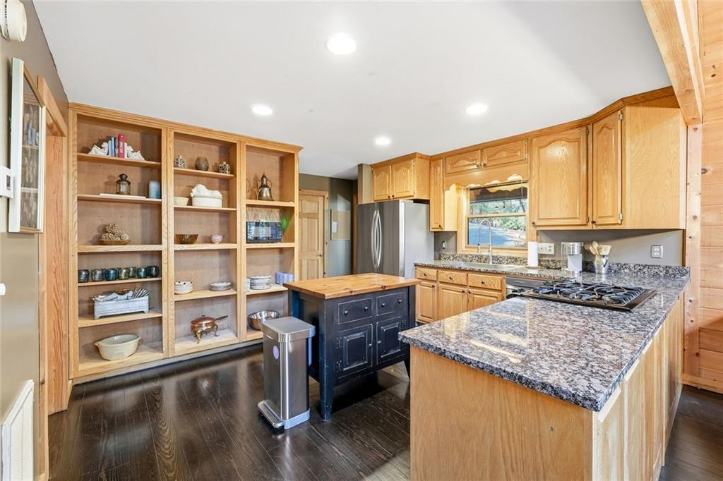834 Indian Cave Road Ellijay, GA 30536 - Photo 5 of 44 a kitchen with stainless steel appliances granite countertop a stove and a refrigerator