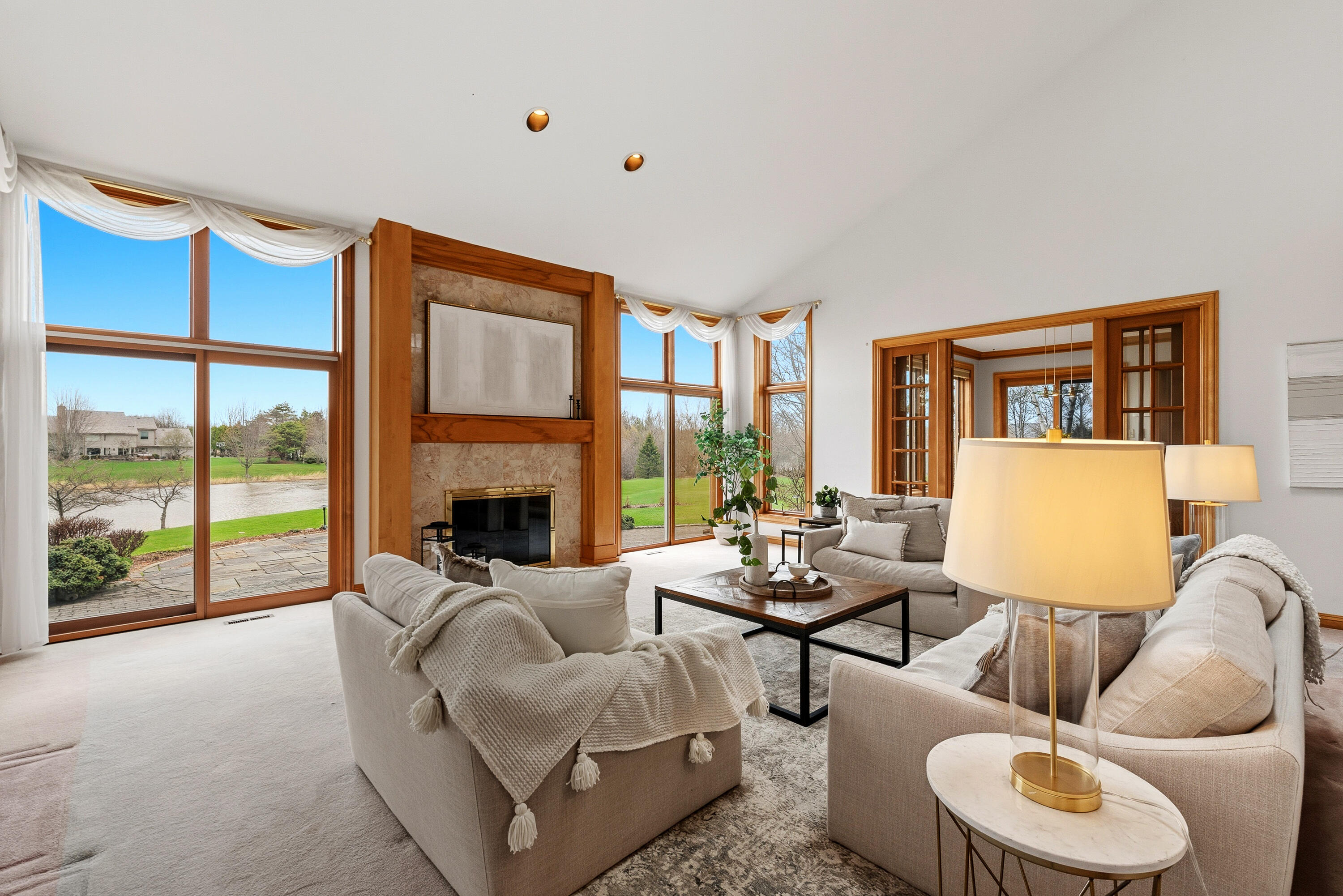 702 West Haddonstone Place Mequon, WI 53092 - Photo 4 of 49 Overlooking Pond Views, Double Patio Doors, Gas Fireplace,French Doors to Kitchen,Vaulted Ceiling, Skylights