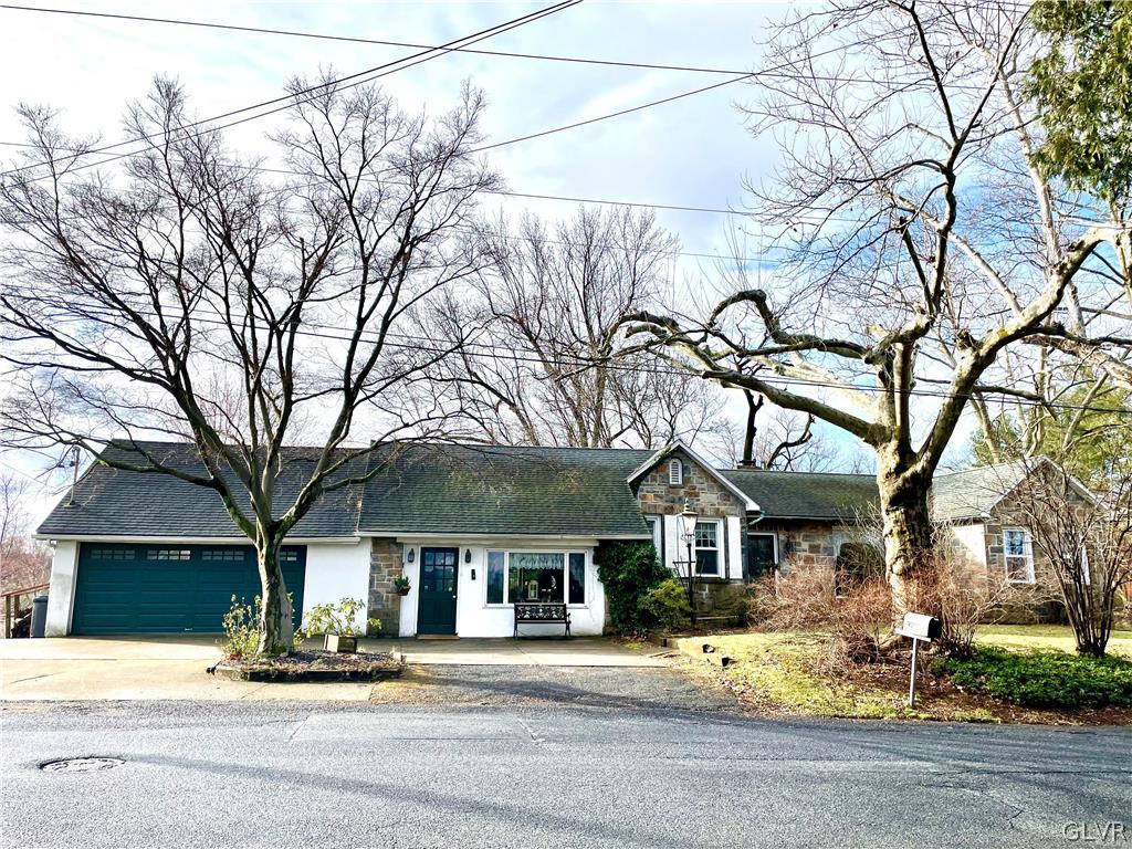 front view of a house with a small yard