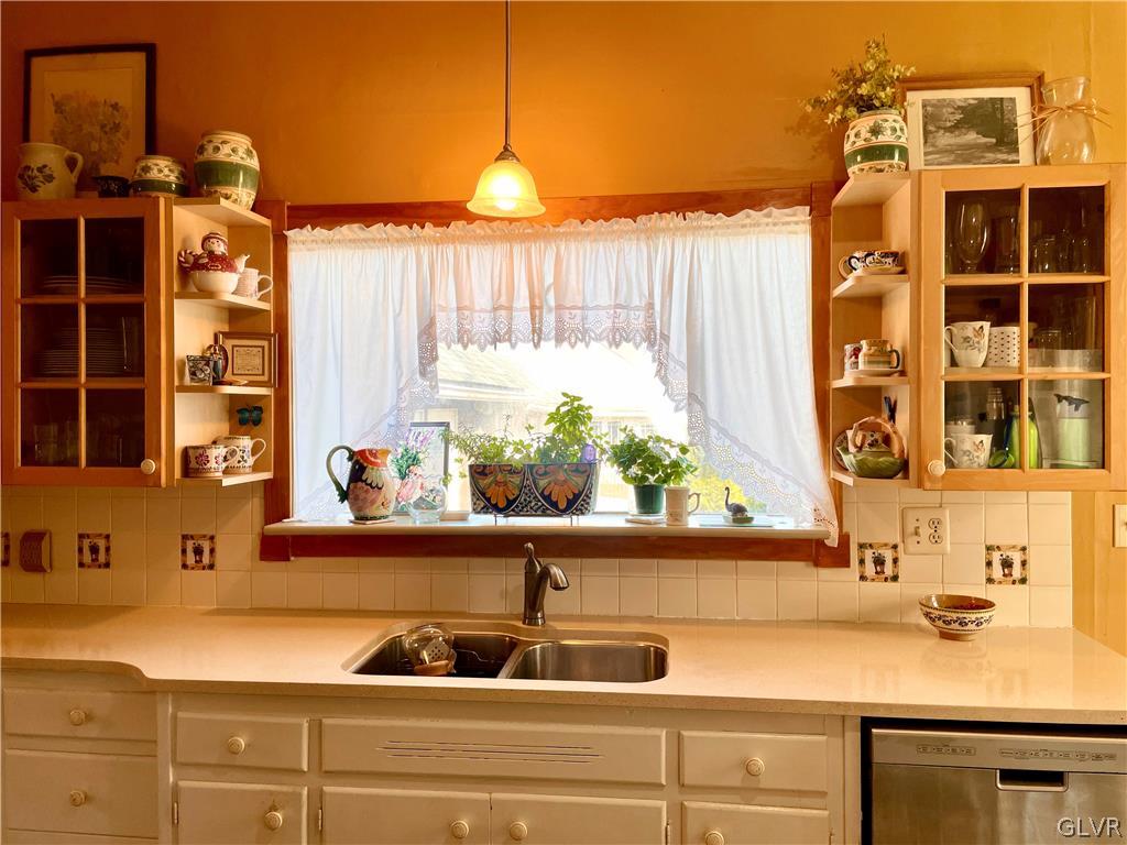 2030 Park Road Easton, PA 18045 - Photo 12 of 40 a sink with a window and chandelier